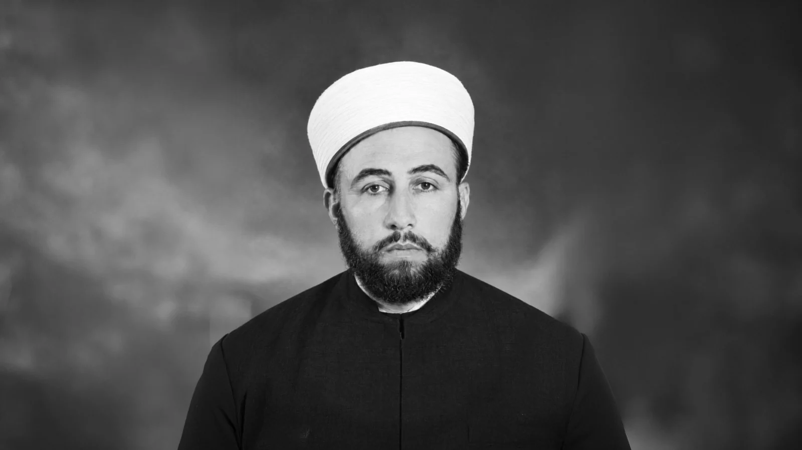 Mehmed Zahid Kotku as a young man, in a white turban and dark robe